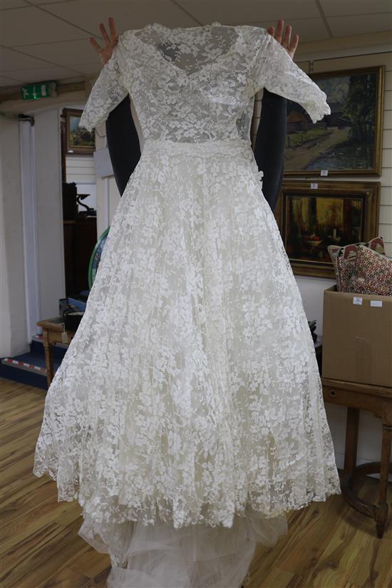 A lace 1940s-50s wedding dress and a skirt